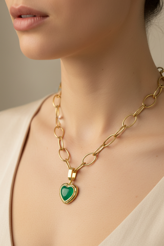 Heart shape cabochon emerald Revival pendant on open link gold chain necklace on model