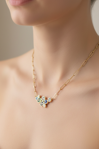 Aquamarine, sapphire and green tourmaline cluster necklace on model